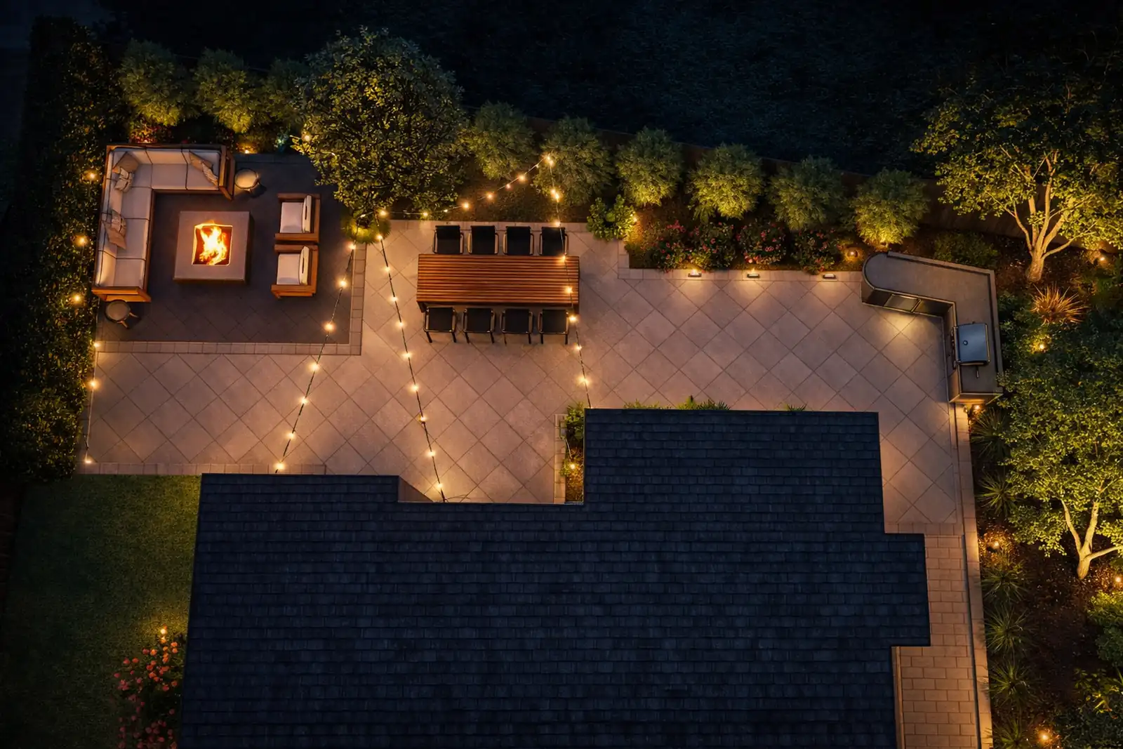 Evening landscape lighting with a lit fire pit and string lights over a paver patio by Panjia Outdoors