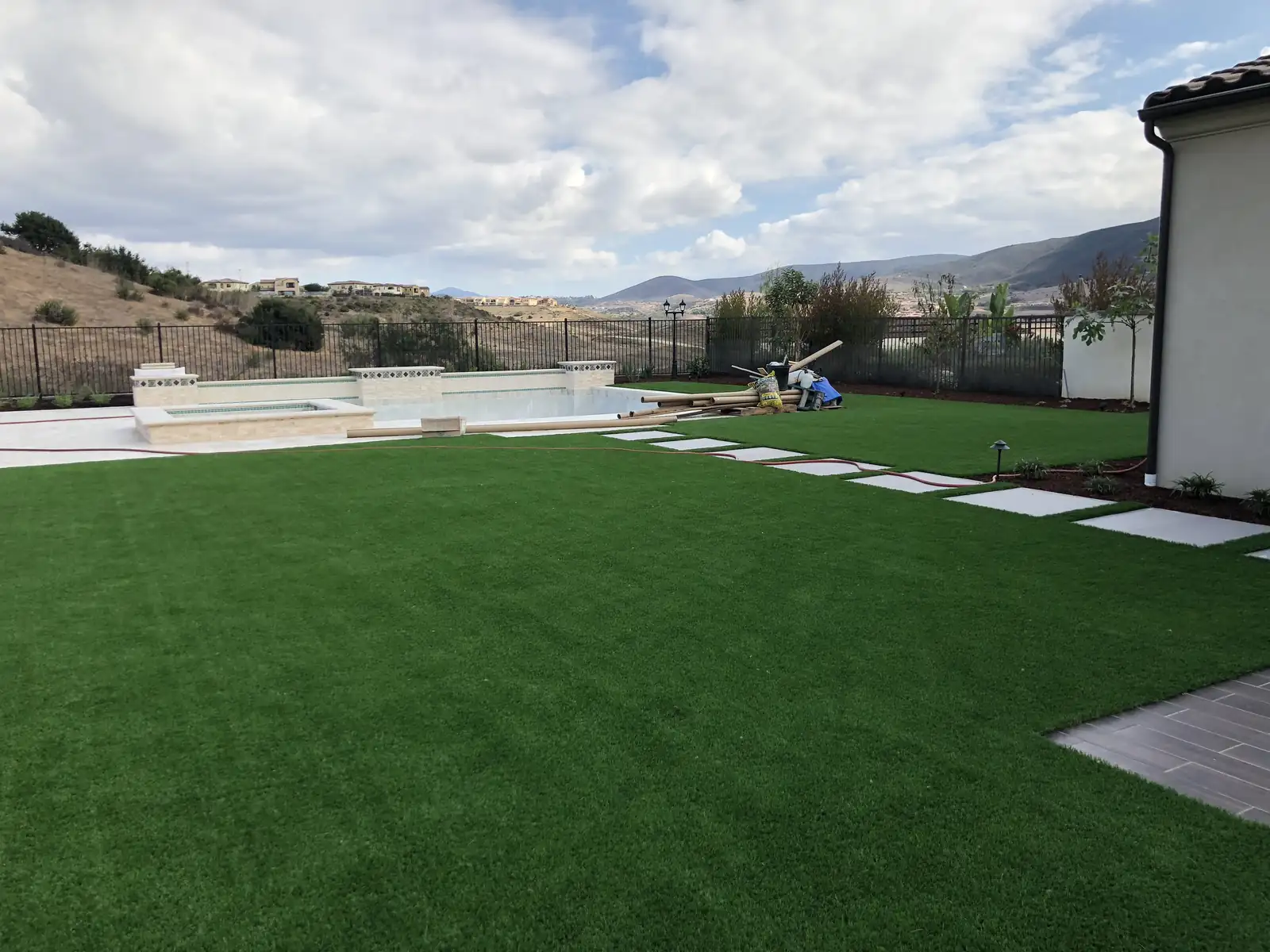 Wide artificial turf lawn with hillside view in North County San Diego by Panjia Outdoors