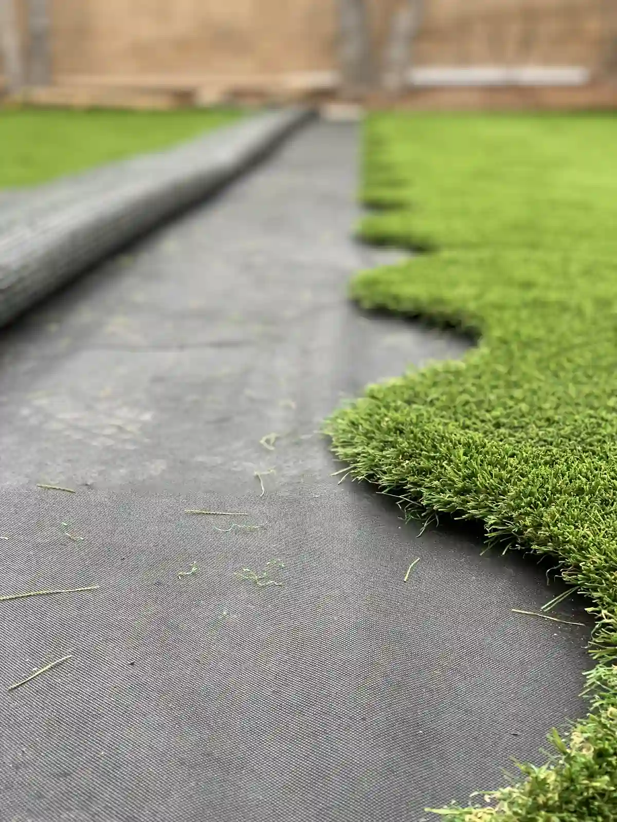 S-Seam artificial turf installation close-up showing wave-pattern seaming