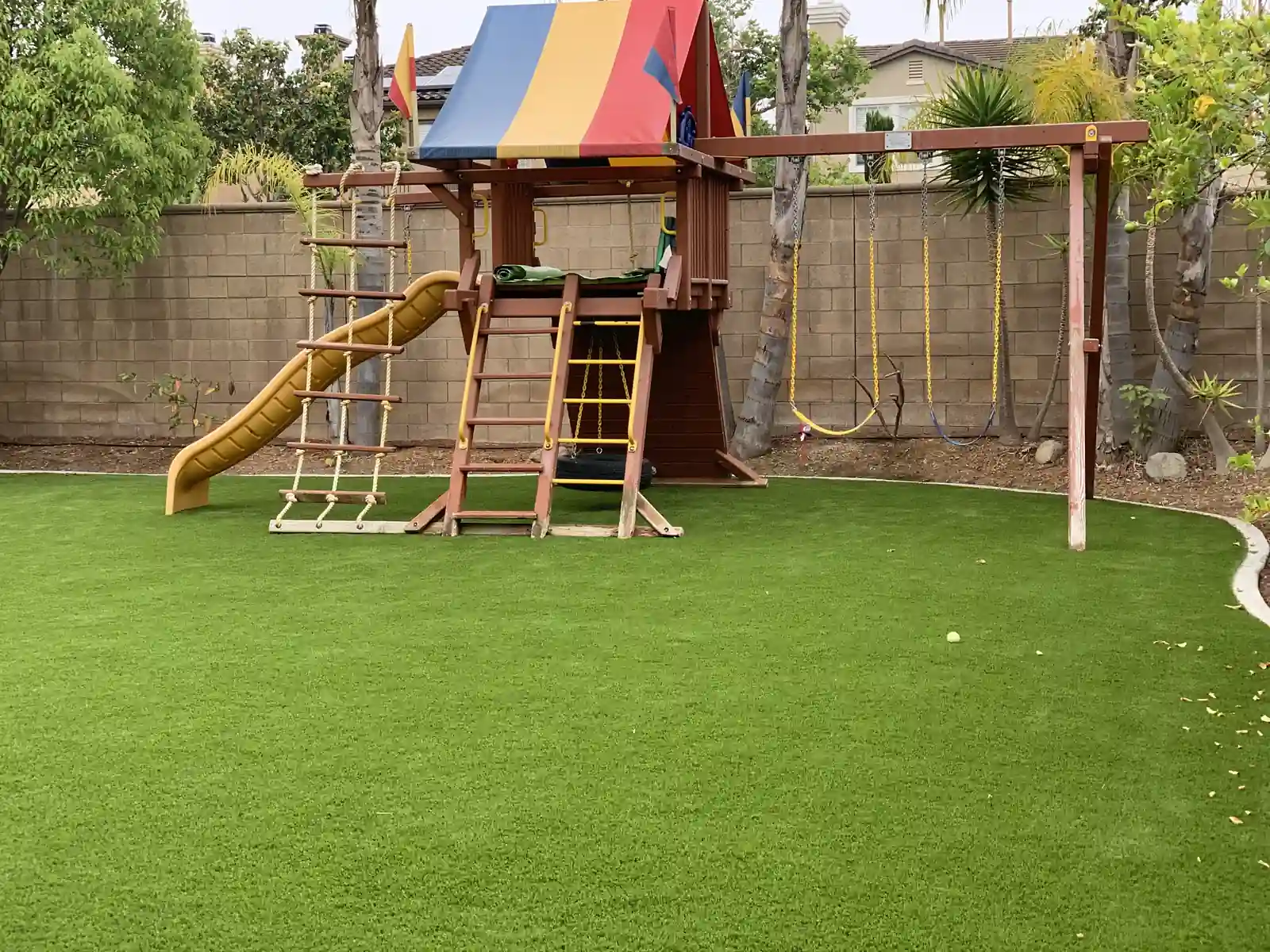 Backyard artificial turf with a play structure, kid and pet friendly, by Panjia Outdoors